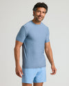 Man wearing Heather Azul Active Crew Neck Tee, looking at the camera.