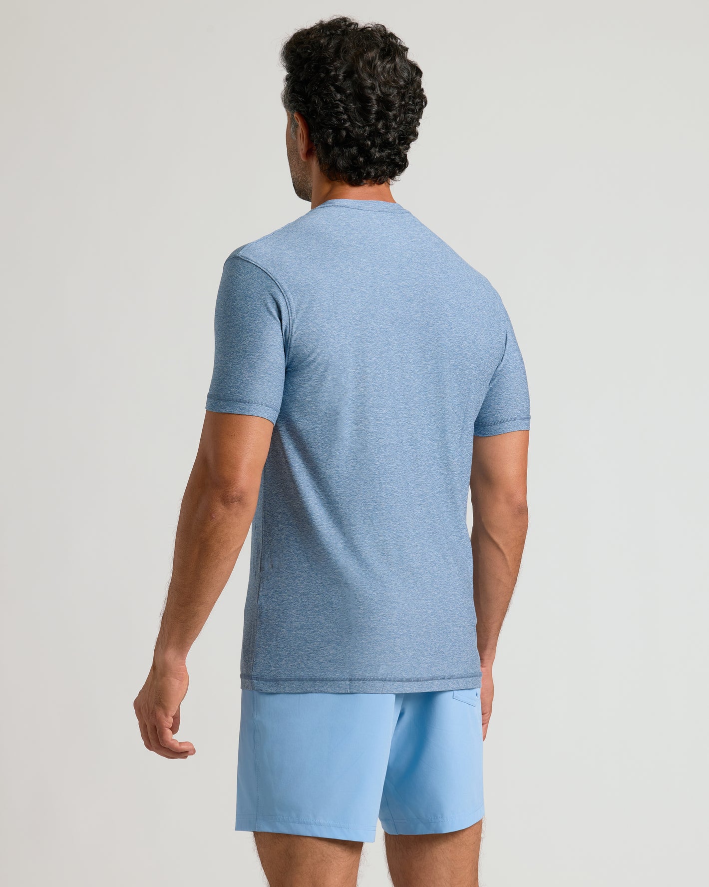 Heather Azul Active Crew Neck Tee, shown from the back on a male model.