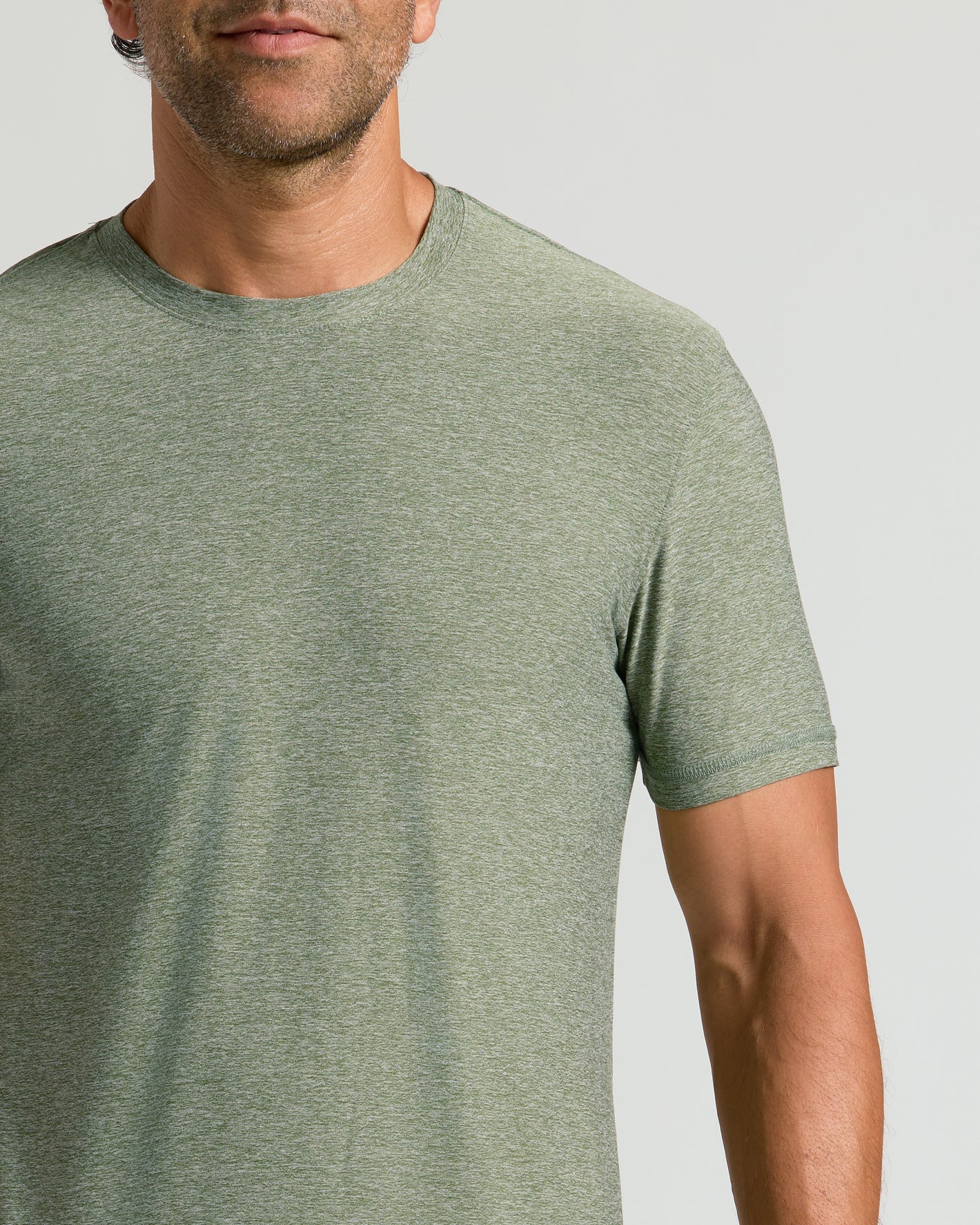 Heather Juniper Active Crew Neck Tee on man's upper torso, highlighting fit.