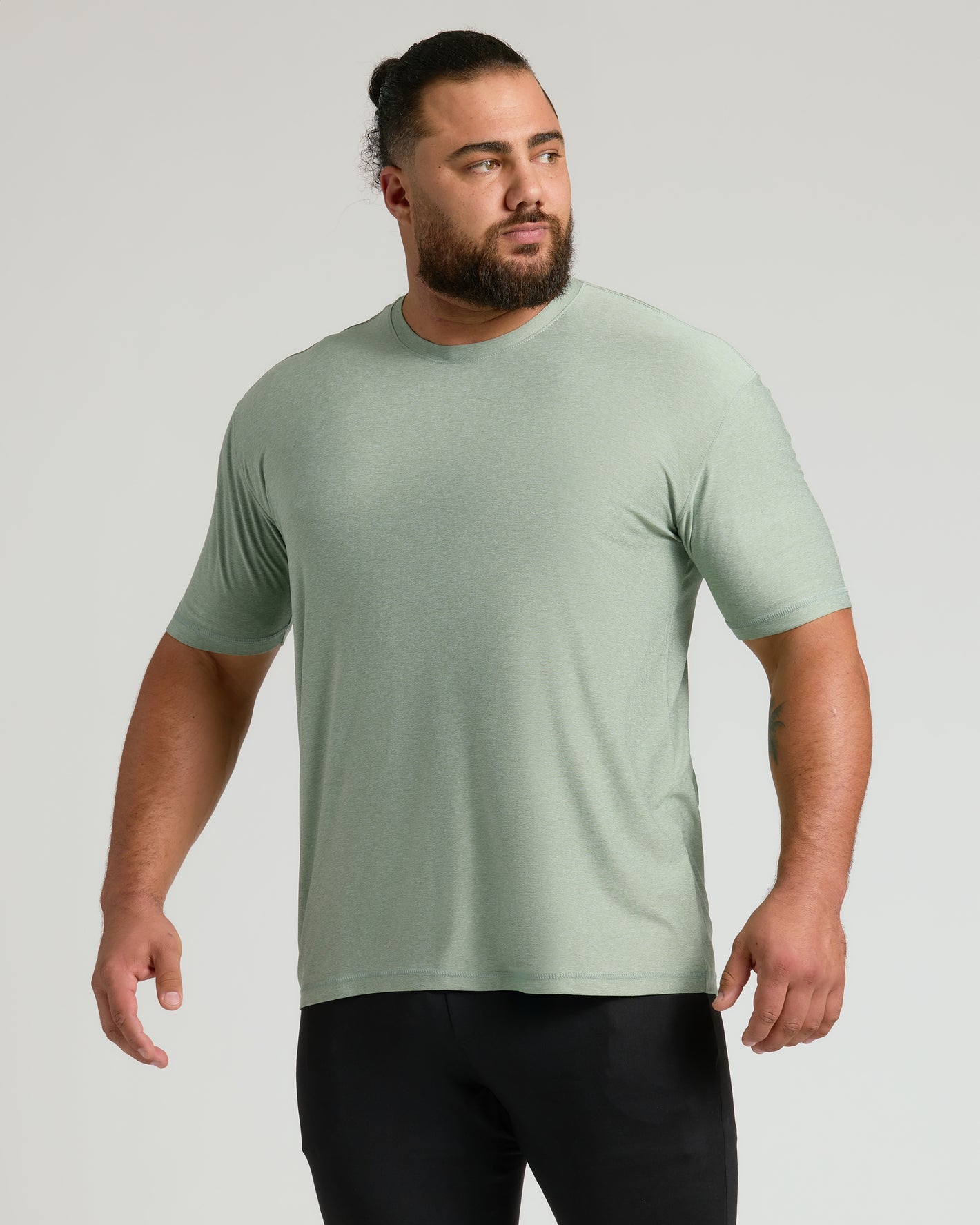 Lichen Active Crew Neck Tee worn by man with bun.