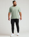 Man models Lichen Active Crew Neck Tee with joggers and sneakers.