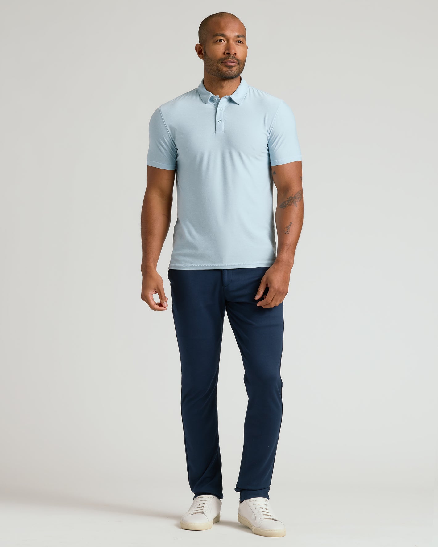 Arctic Active Polo 2.0 worn by man with tattoos.