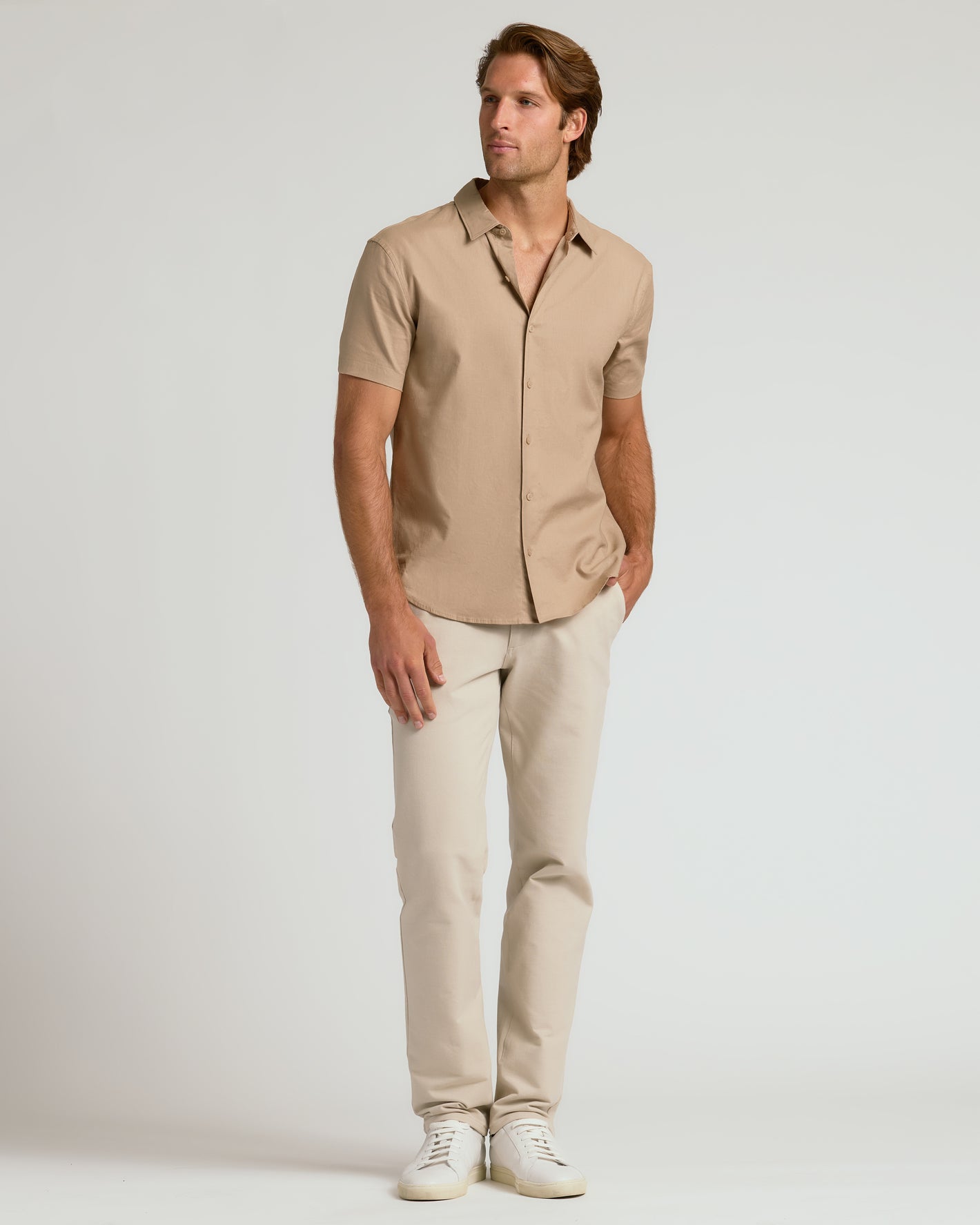 Model wearing Dusty Taupe Short Sleeve Linen Shirt with beige trousers.