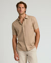 Man in The Standard Short Sleeve Linen Shirt, hands-in-pocket pose.