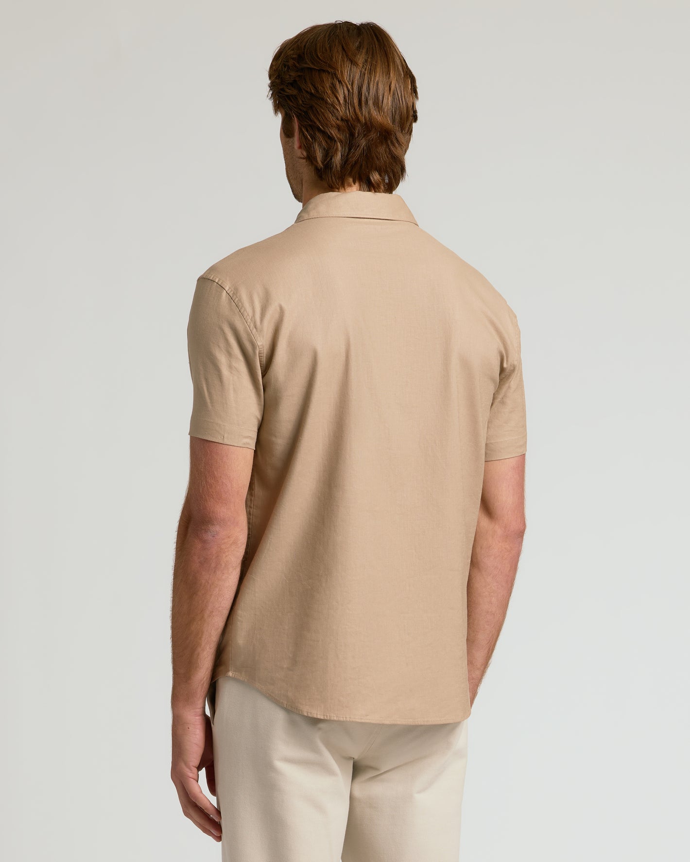 Man wearing Dusty Taupe Short Sleeve Linen Shirt, relaxed fit.