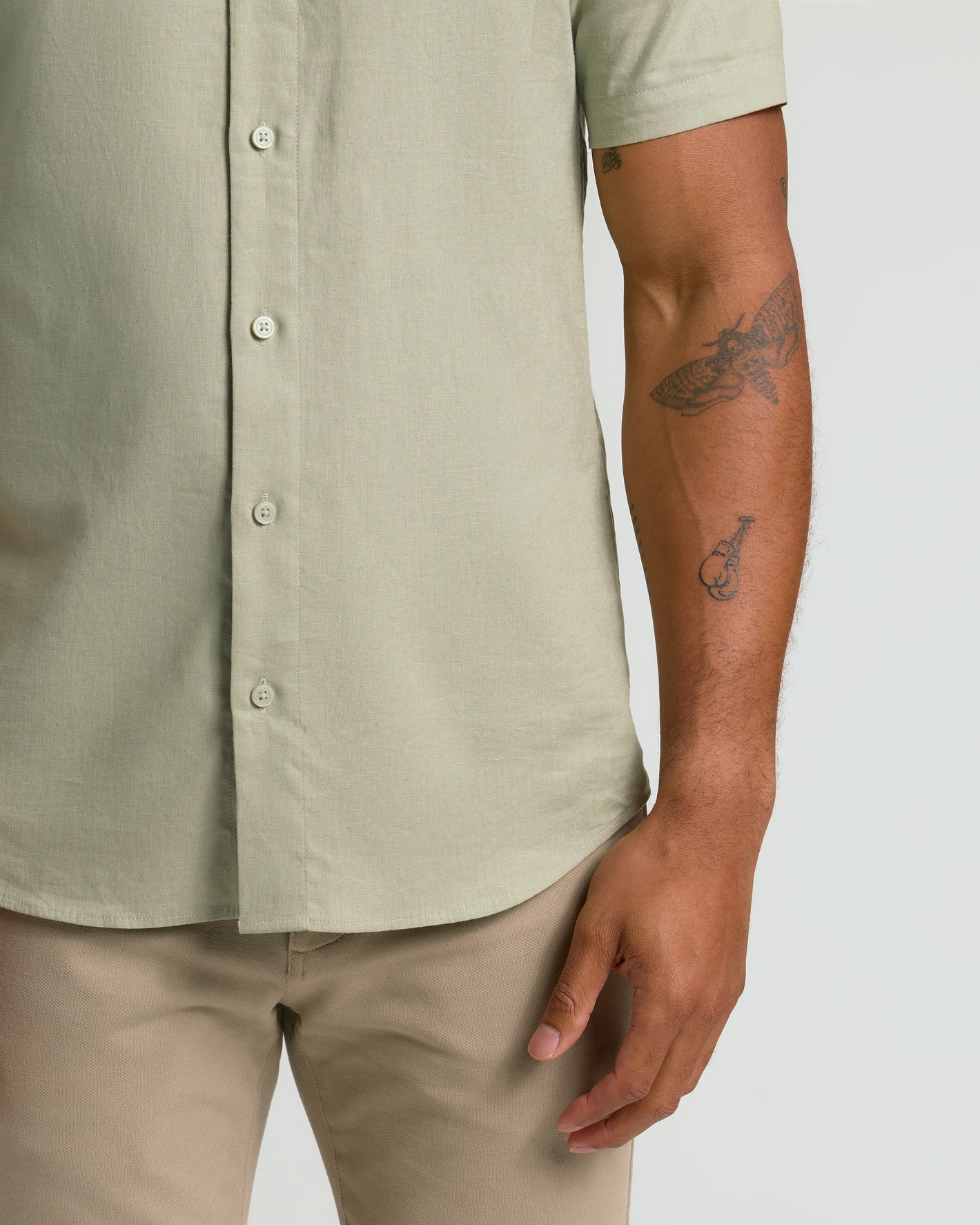 Mossy Oak Short Sleeve Linen Shirt worn untucked over khaki pants.