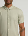 Man wearing Mossy Oak Short Sleeve Linen Shirt with moth tattoo.