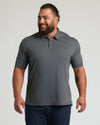 Man in Carbon Premium Pima Polo with tailored fit and three-button placket.