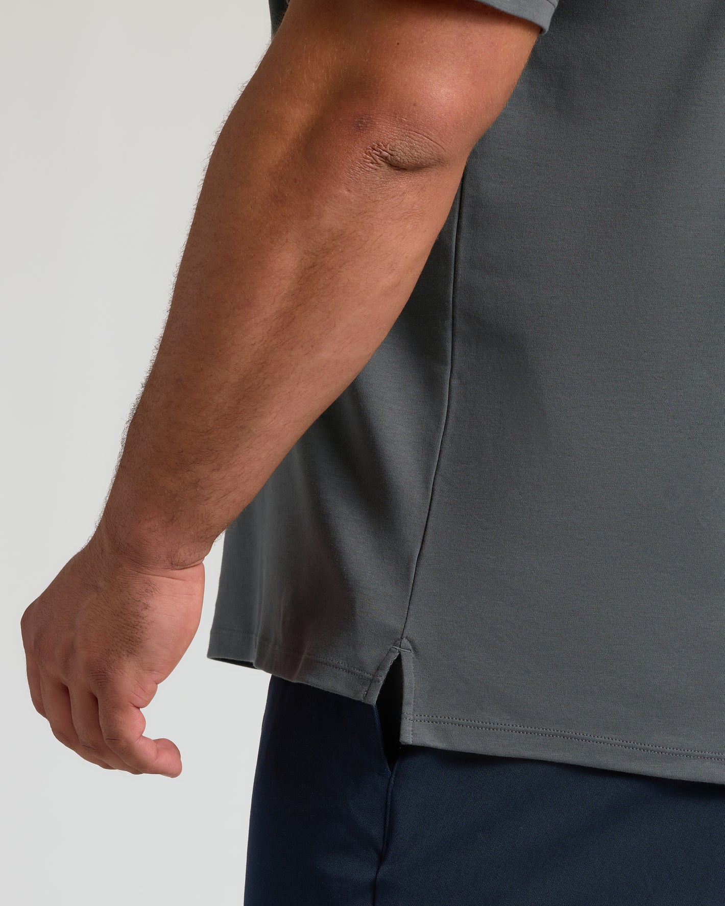 Carbon Premium Pima Polo sleeve detail, showcasing silky, breathable fabric.
