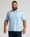 Man in Ether Premium Pima Polo, smiling, showcasing tailored fit.