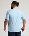 Ether Premium Pima Polo on man, back view, light-blue, tailored fit.