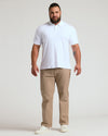 Man in White Premium Pima Polo, khaki pants, white sneakers.