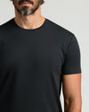Man wearing Black Premium Pima Crew Curved Hem Tee.