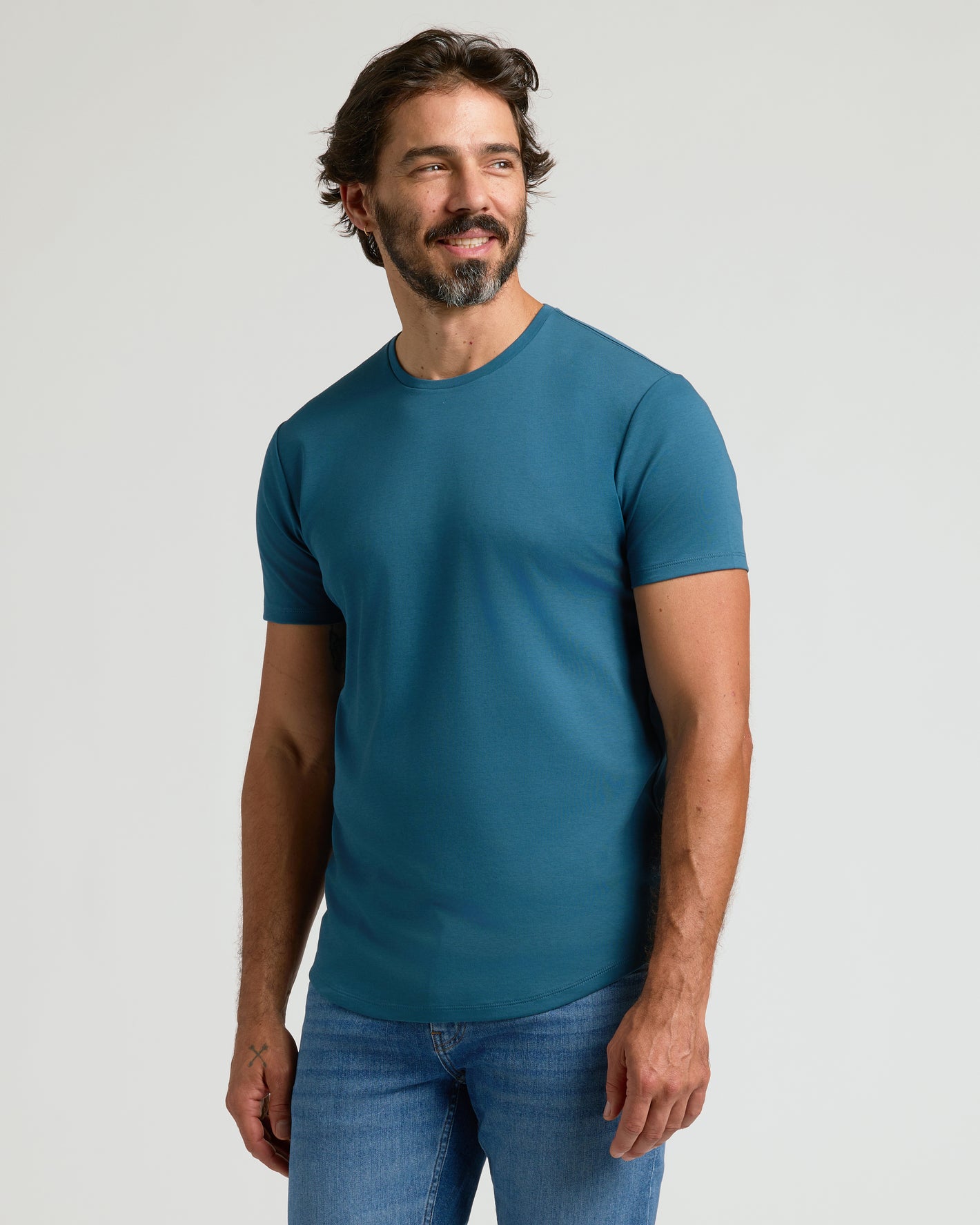 Man wearing Lagoon Premium Pima Crew Curved Hem tee.
