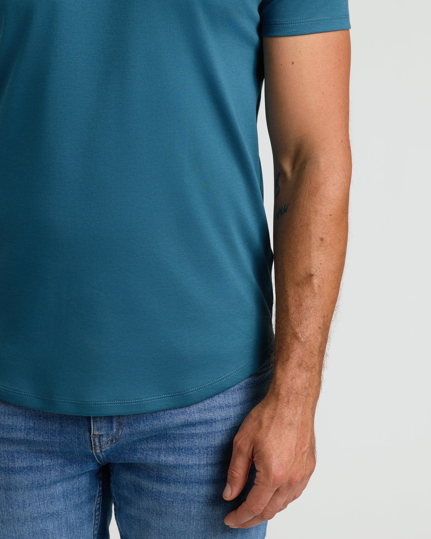Lagoon Premium Pima Crew Curved Hem T-shirt worn over jeans.