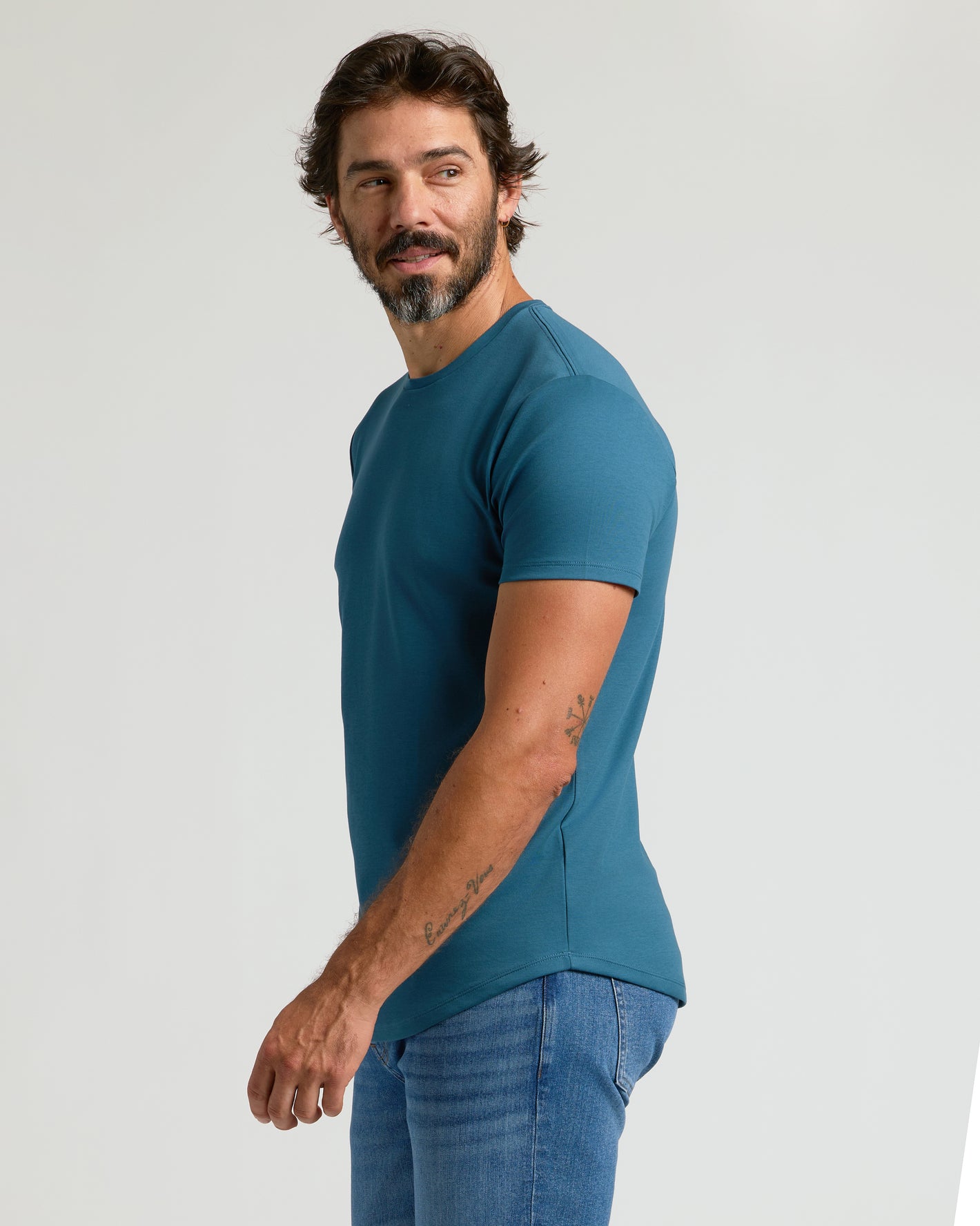 Lagoon Premium Pima Crew Curved Hem on man in profile view.
