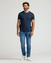 Navy Premium Pima Crew Curved Hem T-shirt on man, showcasing tailored fit.