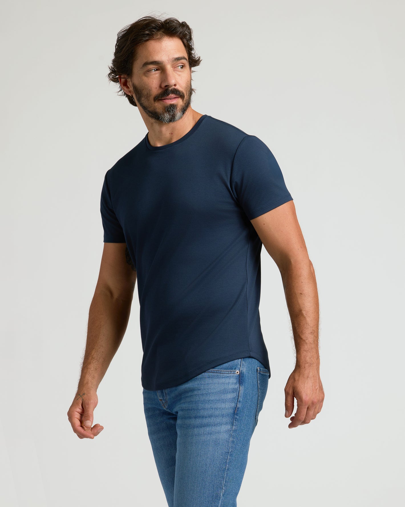 Man wearing Navy Premium Pima Crew Curved Hem T-shirt.