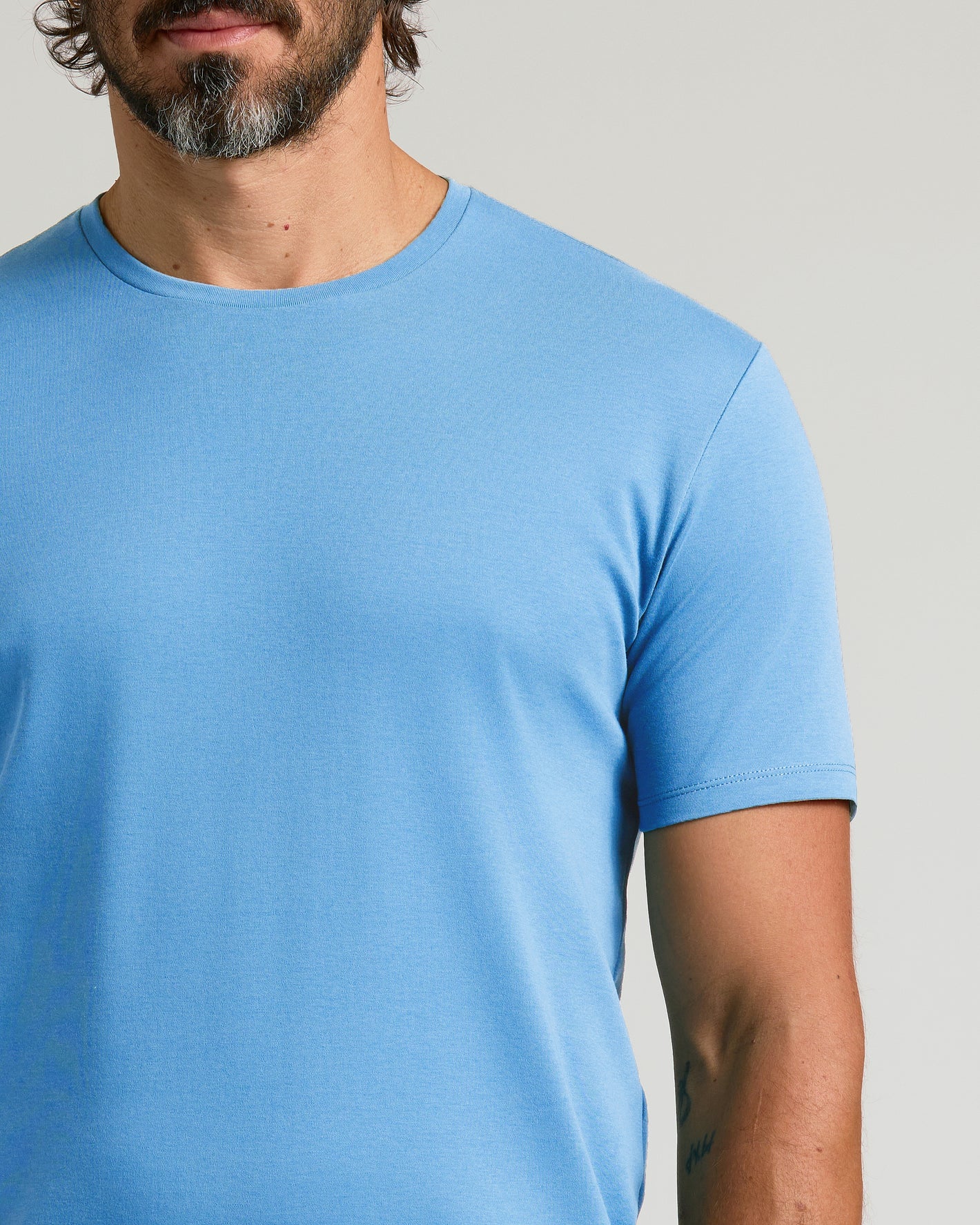 Cerulean Premium Pima Crew Neck on model, showcasing fit and fabric details.