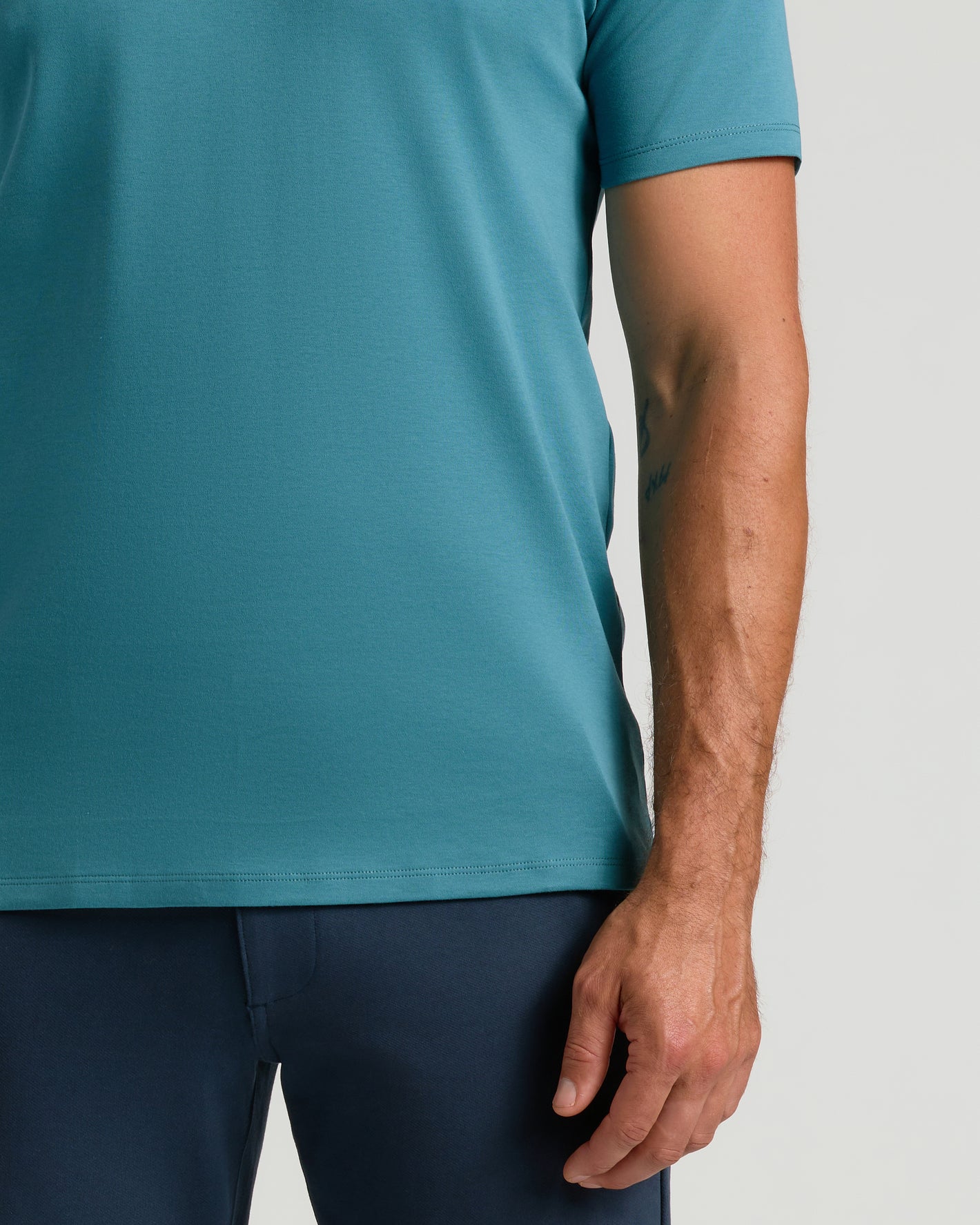 Sapphire Premium Pima Crew Neck on model's torso and arm.