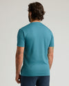 Back view of person in Sapphire Premium Pima Crew Neck, displaying arm tattoos.