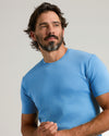 Man wearing Cerulean Premium Pima Crew Neck, looking to the side.