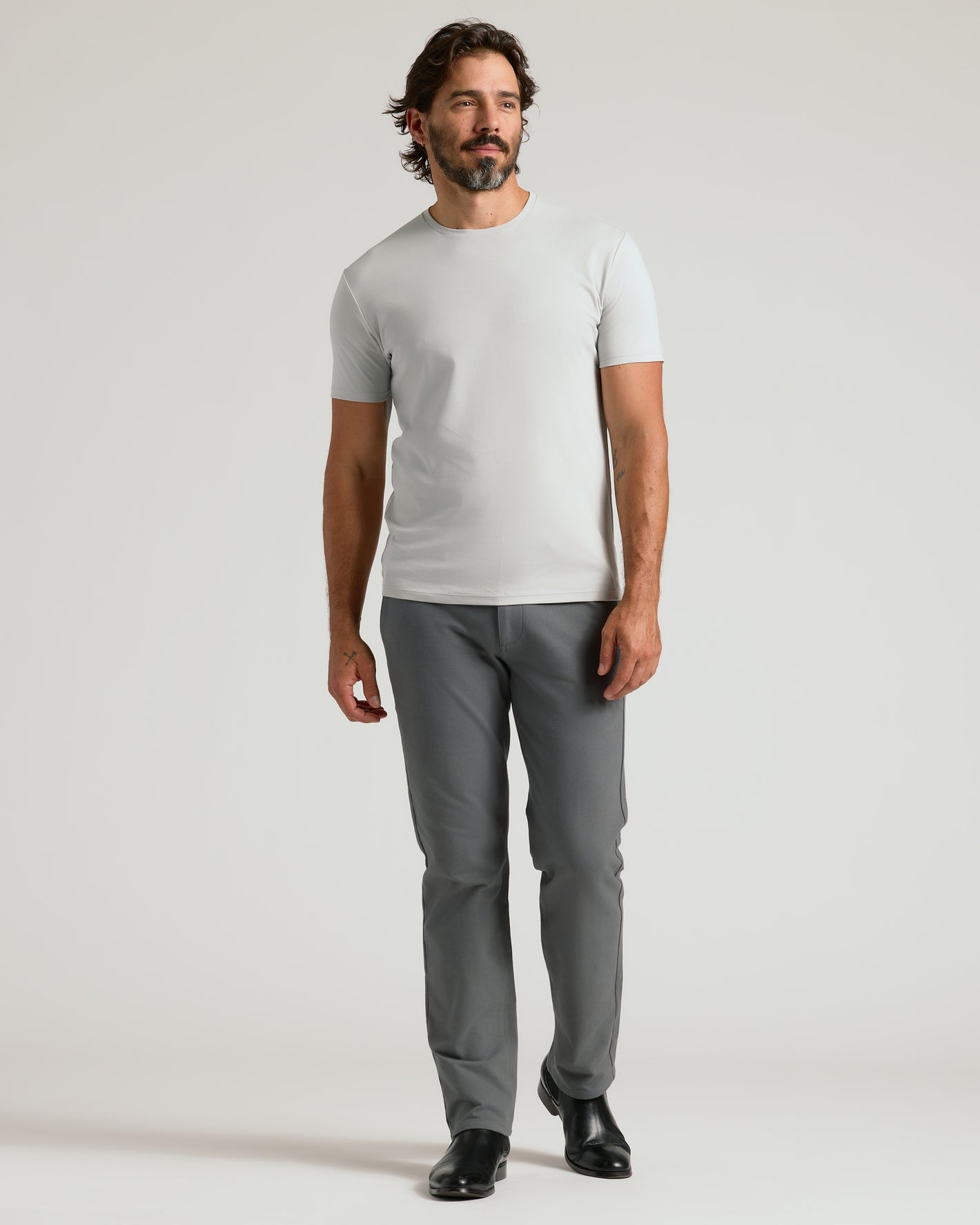 Door Buster Premium Pima Crew 7-Pack on male model in gray trousers.