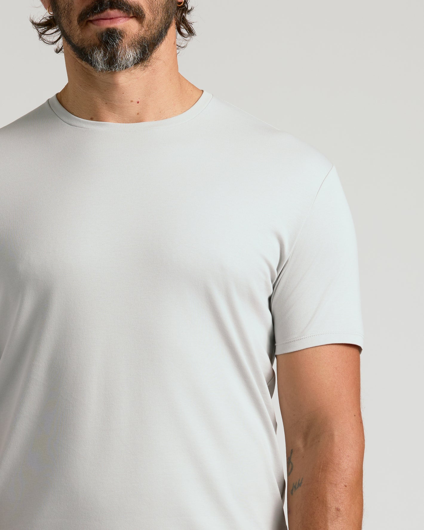 Man wearing Door Buster Premium Pima Crew 7-Pack shirt.