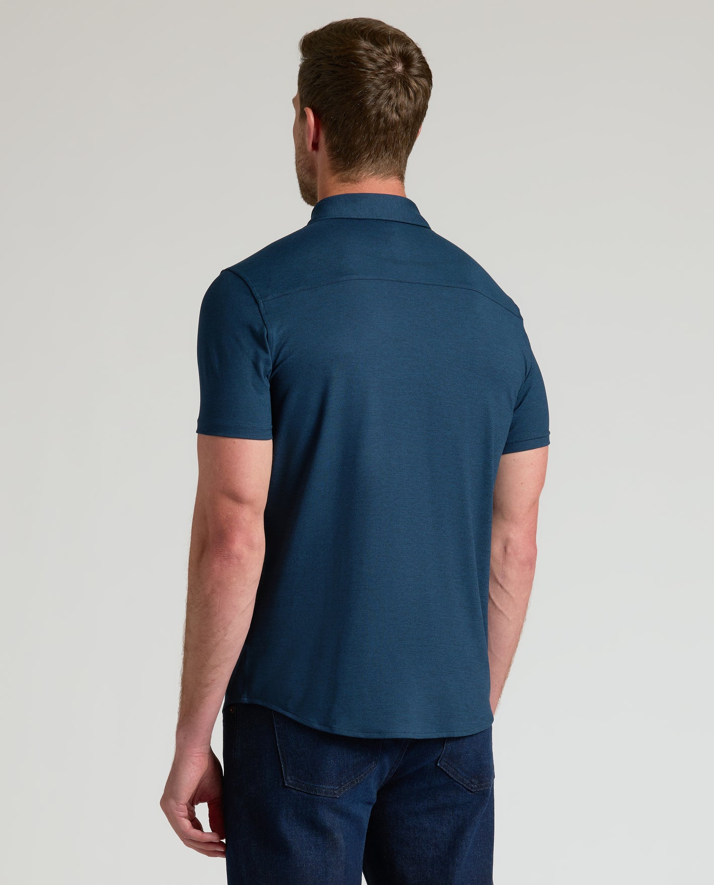 Man wearing Dark Heather Navy Short Sleeve Comfort Knit Shirt.