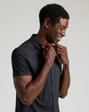 Black Short Sleeve Comfort Knit Shirt worn by smiling man adjusting collar.