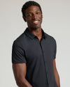 Man wearing Black Short Sleeve Comfort Knit Shirt, showcasing its casual, polished look.