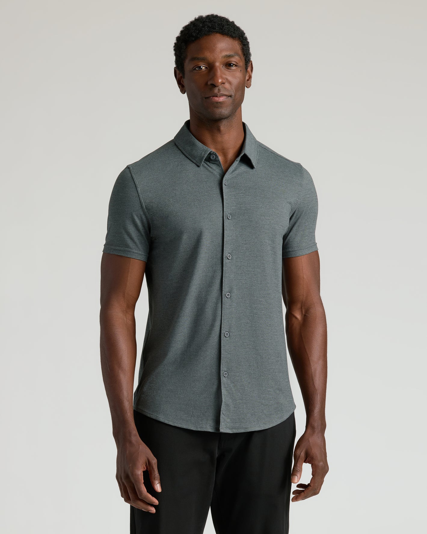 Man wearing Dark Heather Navy & Charcoal Heather Gray Short Sleeve Comfort Knit Shirt.