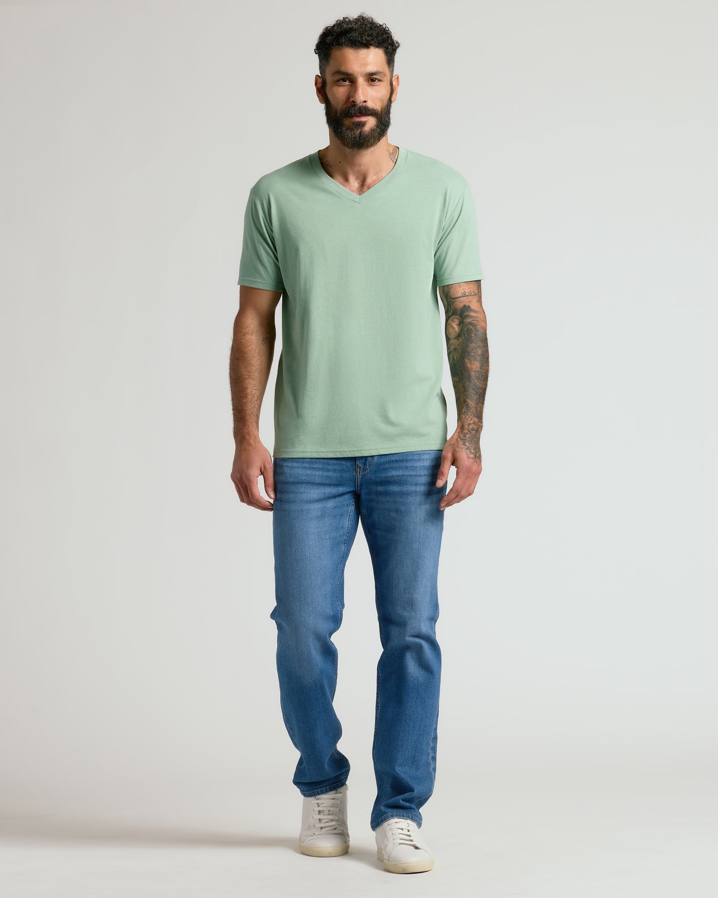 Man in Heather Slate Green Classic V-Neck, showcasing fit and comfort.