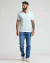Icicle Classic V-Neck on bearded man with sleeve tattoo, showcasing fit.