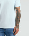 Icicle Classic V-Neck, showcasing arm-accentuating fit with tattooed arm detail.