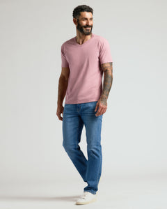 True ClassicMan wearing a Light Heather Boysenberry Classic V-Neck, smiling casually.