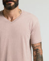 Man in Light Heather Slate Mauve Classic V-Neck shirt, tattoos visible.