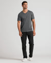 Carbon Premium Pima V-Neck modeled with black pants and white sneakers.