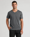 Man wearing Carbon Premium Pima V-Neck, smiling casually.