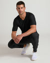 Man wearing Black Active V-Neck 3-Pack, squatting, displaying modern fit.