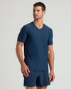 Model wearing Active V-Neck 3-Pack, showcasing dark-blue athletic shirt and shorts.
