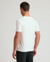 Man wearing Active V-Neck 3-Pack white T-shirt, black shorts.