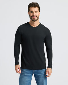 True ClassicMan wearing a black long-sleeve shirt and blue jeans on a light gray background