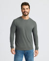 Man wearing Seasonal Classic Long Sleeve Henley in forest green.