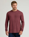 Male model in Dark Heather Clovewood Classic Long Sleeve Crew Neck.