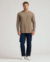 Man in Classic Long Sleeve Crew Neck, khaki, jeans, and sneakers.