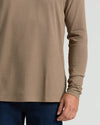 Dark Heather Sagewood Classic Long Sleeve Crew Neck with jeans, midsection view.