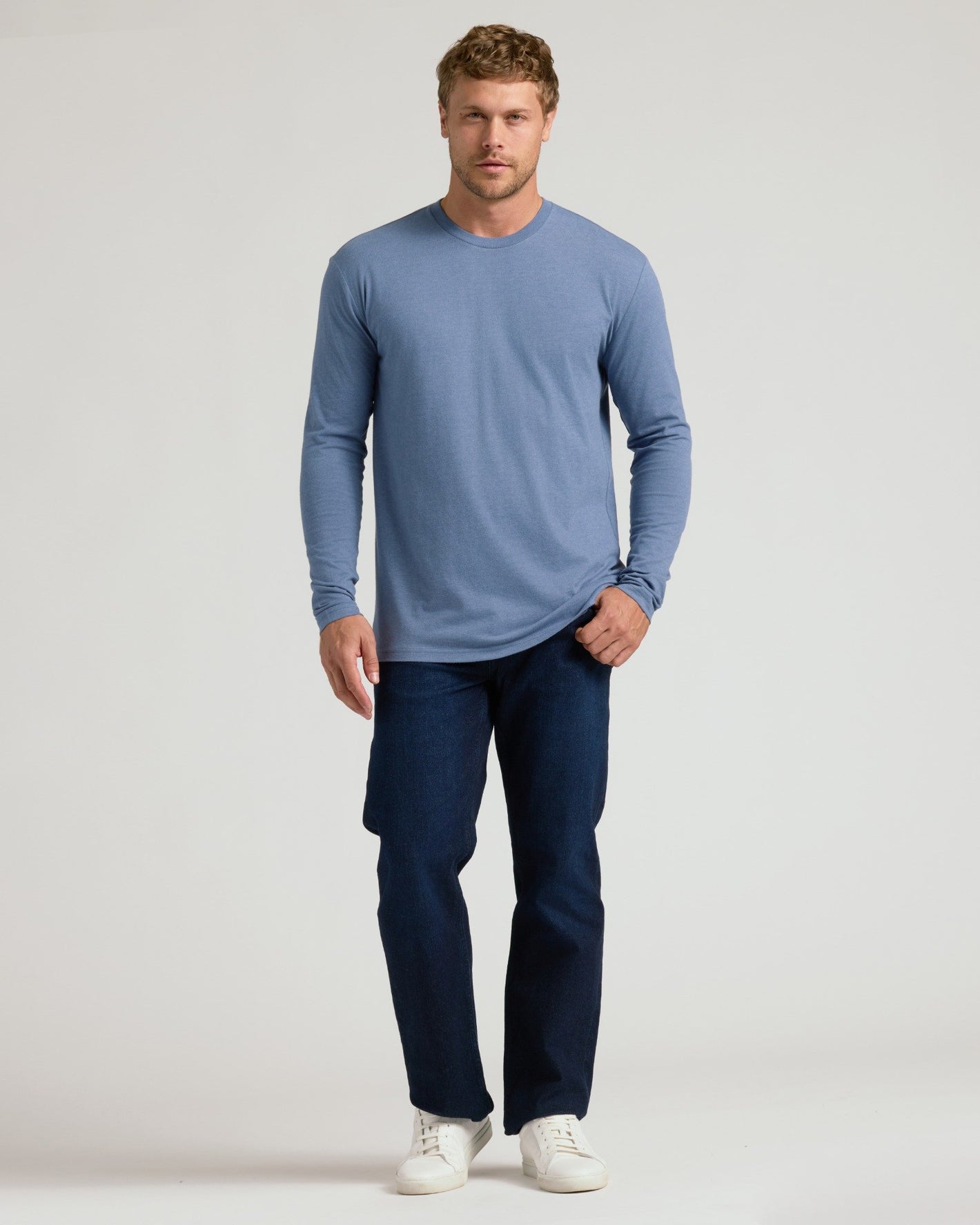 Model in Seasonal Classic Long Sleeve Henley, muted blue shade.