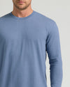 Man wearing Dark Heather Vintage Navy Classic Long Sleeve Crew Neck.