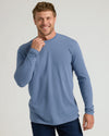 Man modeling Seasonal Classic Long Sleeve Henley, showcasing fit and style.